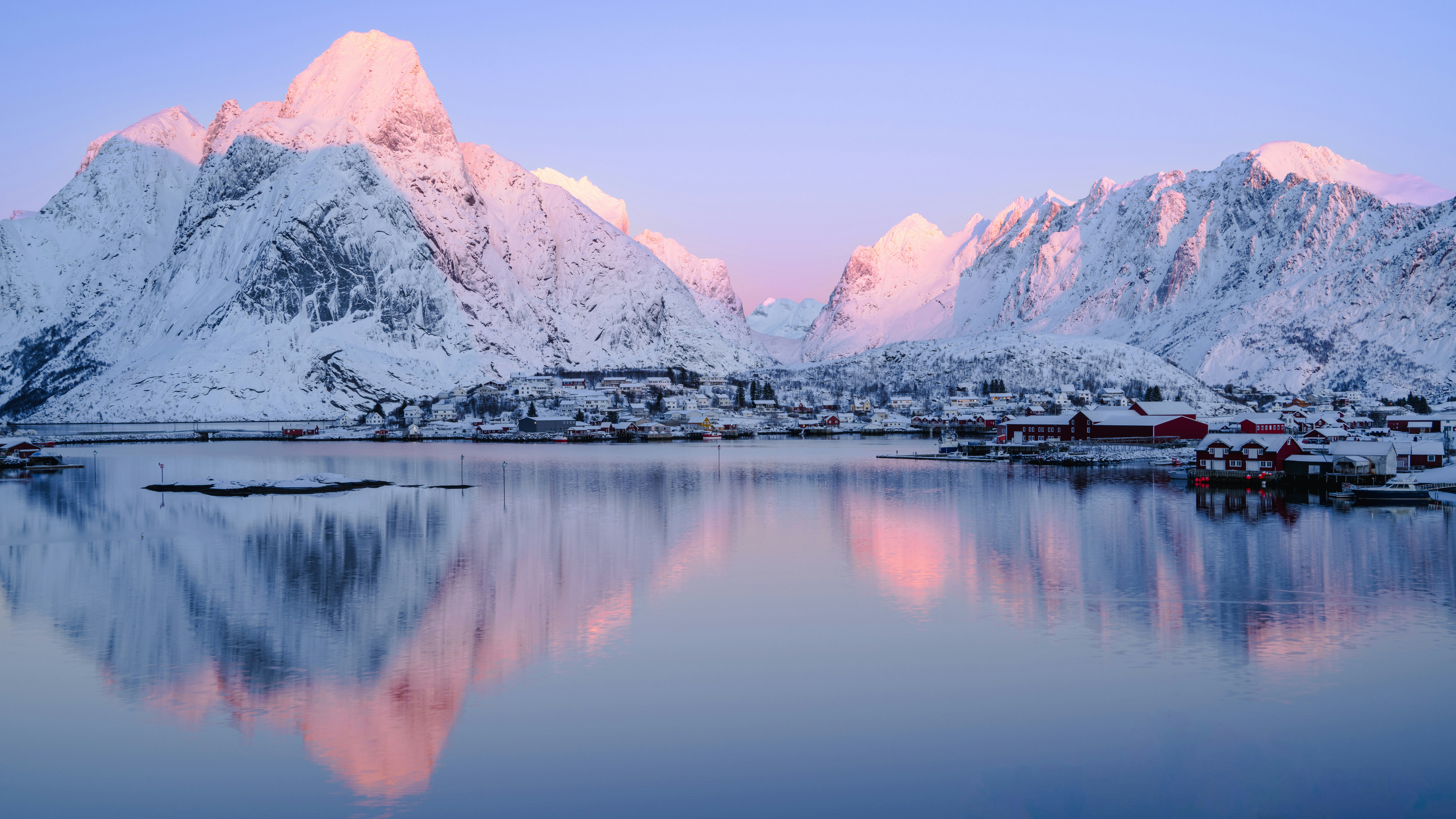 Photo by Himmel S on Unsplash. Icy fjord and a small town.